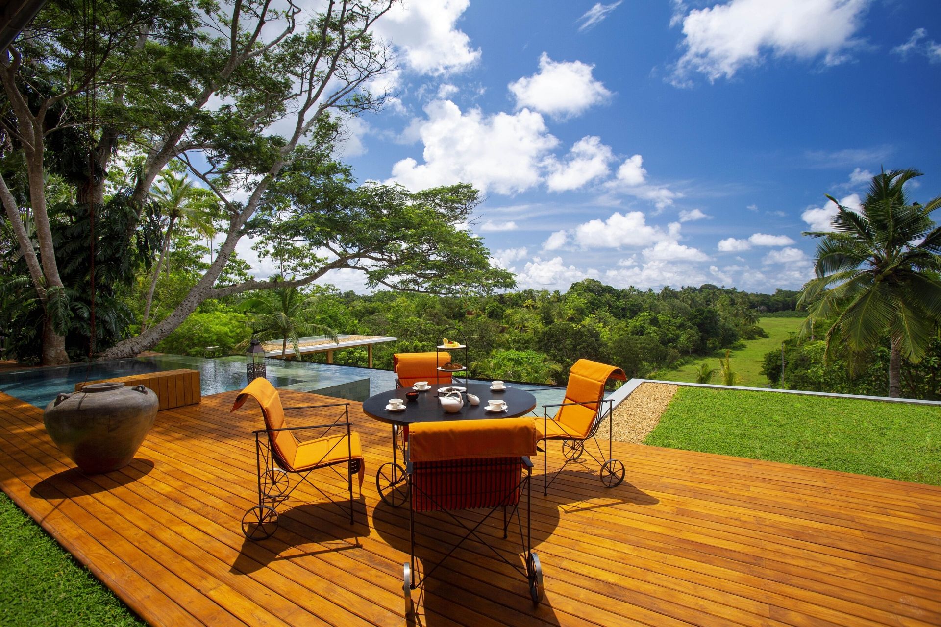 Outdoor lounge area of the colonial mansion overlooking the pool