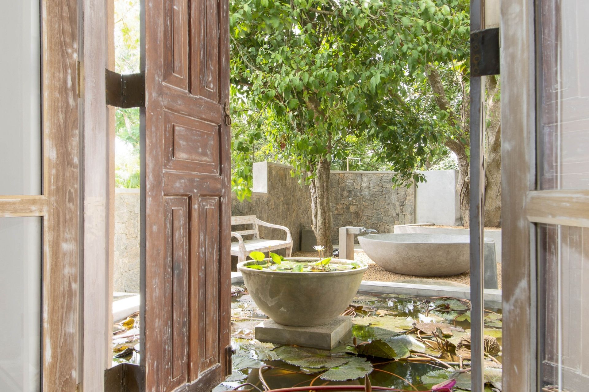 Outdoor lounge area of the colonial mansion overlooking the pool