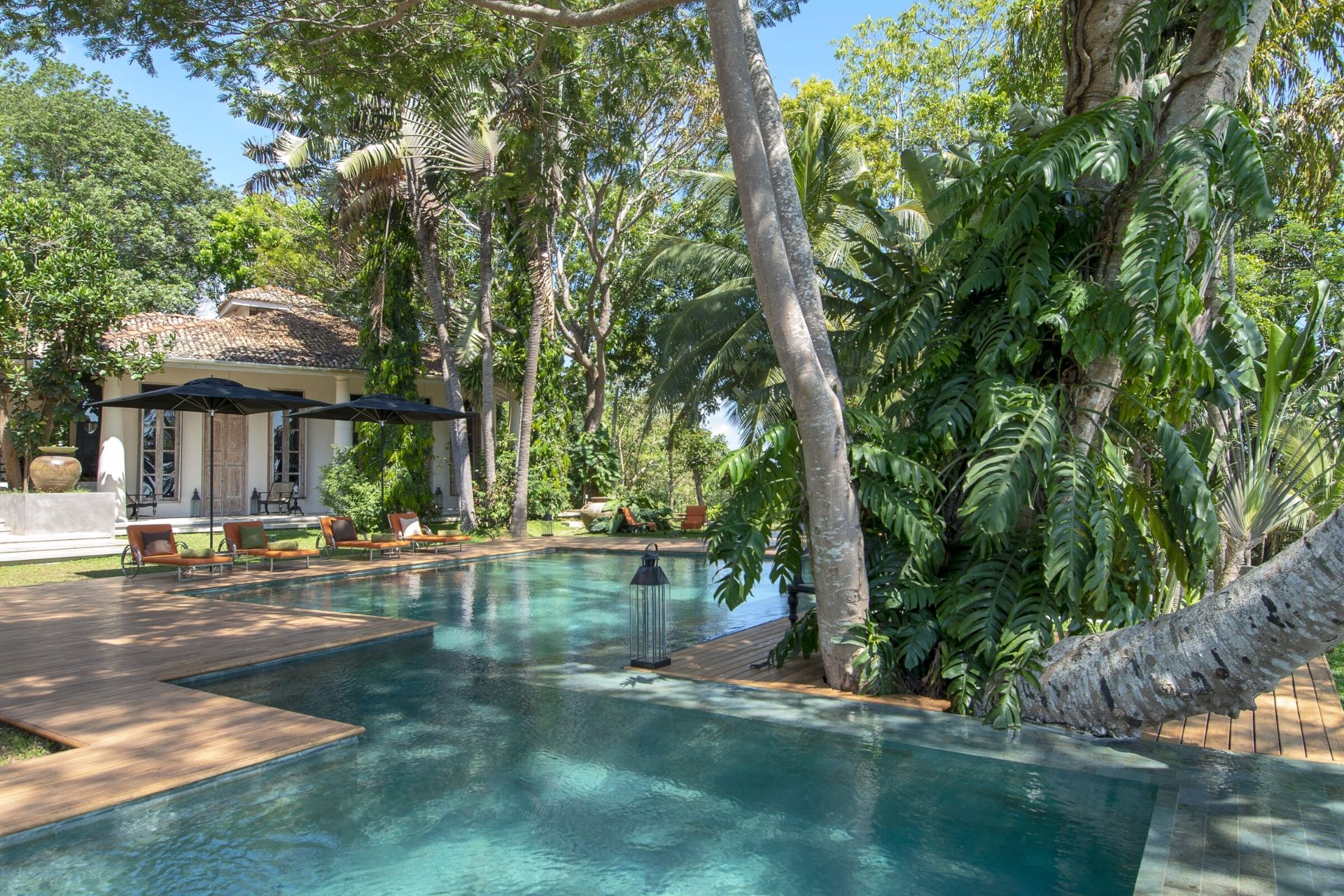 Outdoor lounge area of the colonial mansion overlooking the pool