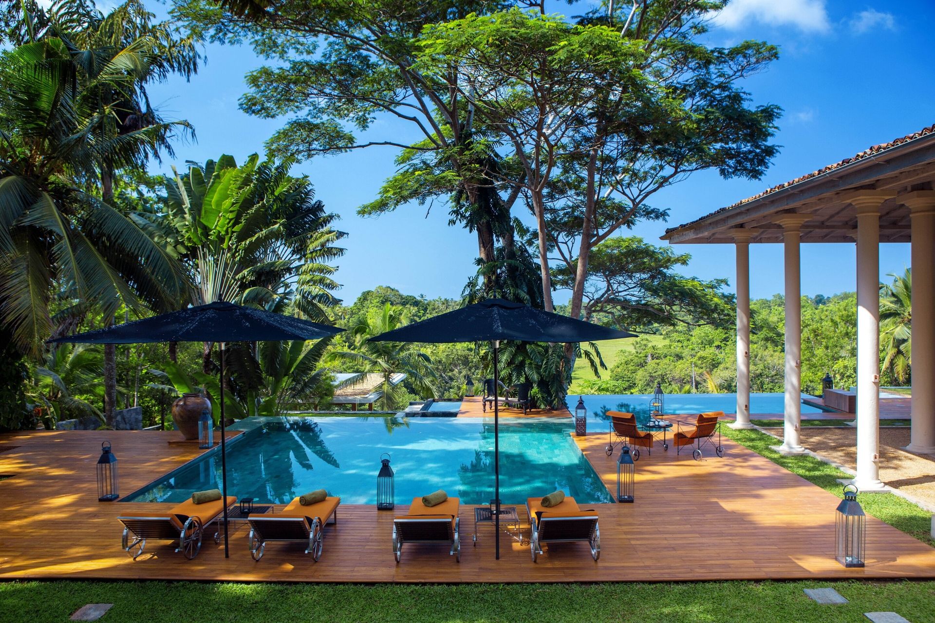 Outdoor lounge area of the colonial mansion overlooking the pool