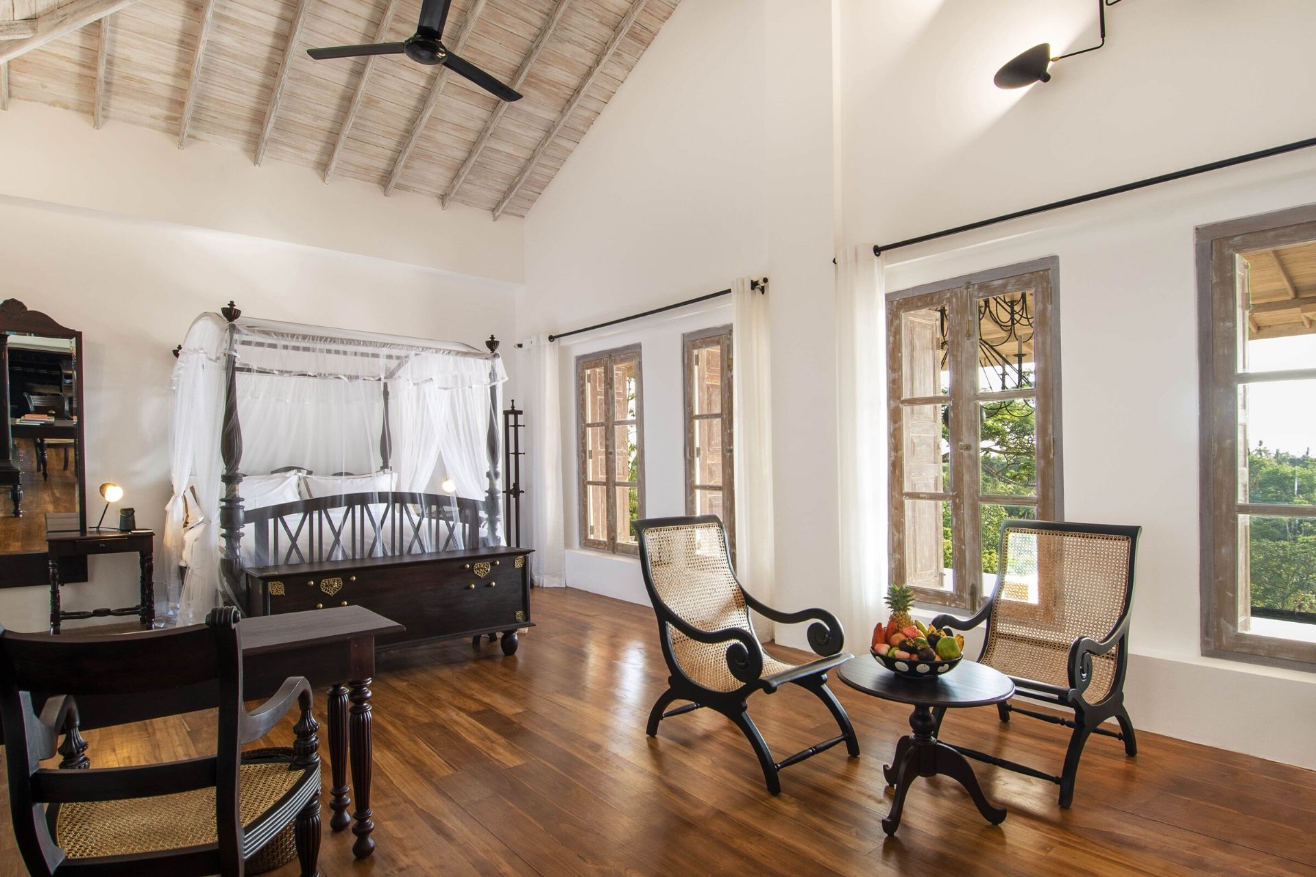 Outdoor lounge area of the colonial mansion overlooking the pool