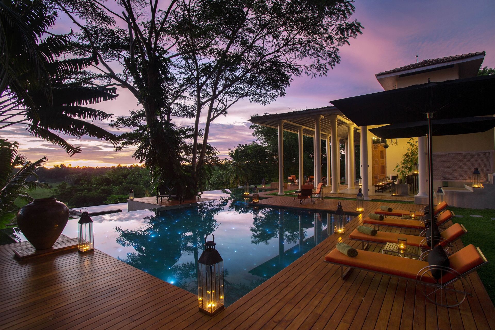 Outdoor lounge area of the colonial mansion overlooking the pool