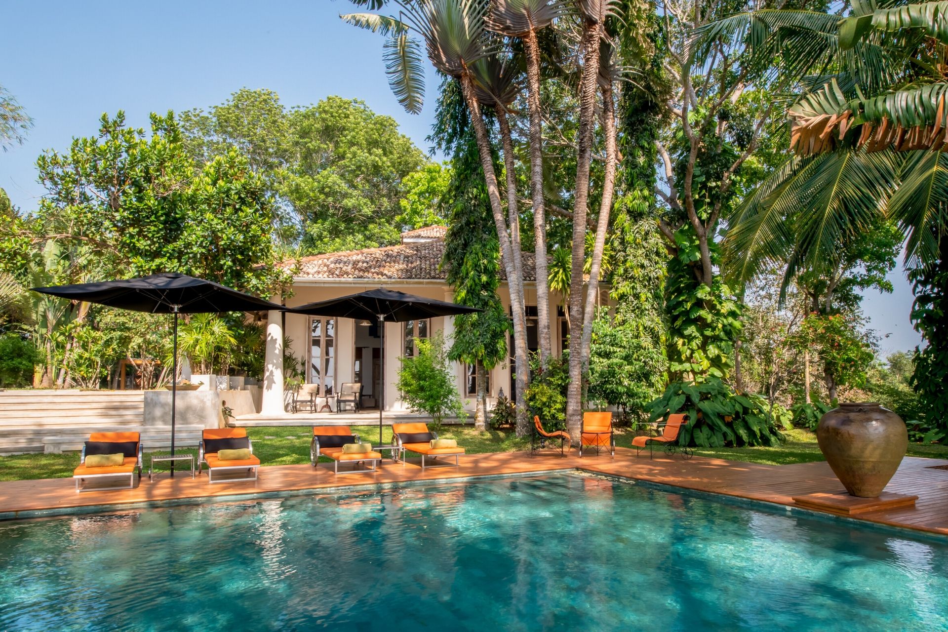 Outdoor lounge area of the colonial mansion overlooking the pool