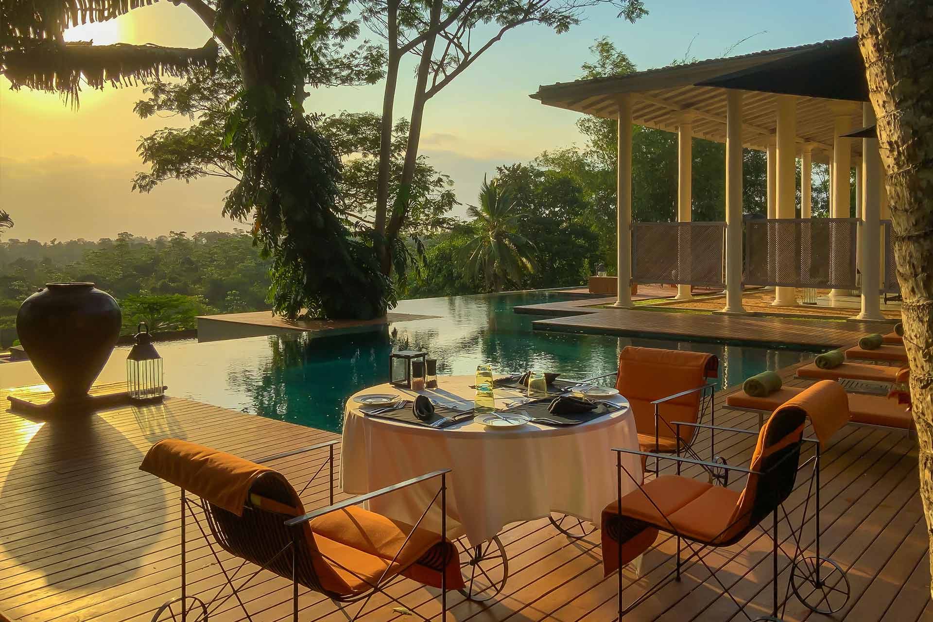 Outdoor lounge area of the colonial mansion overlooking the pool