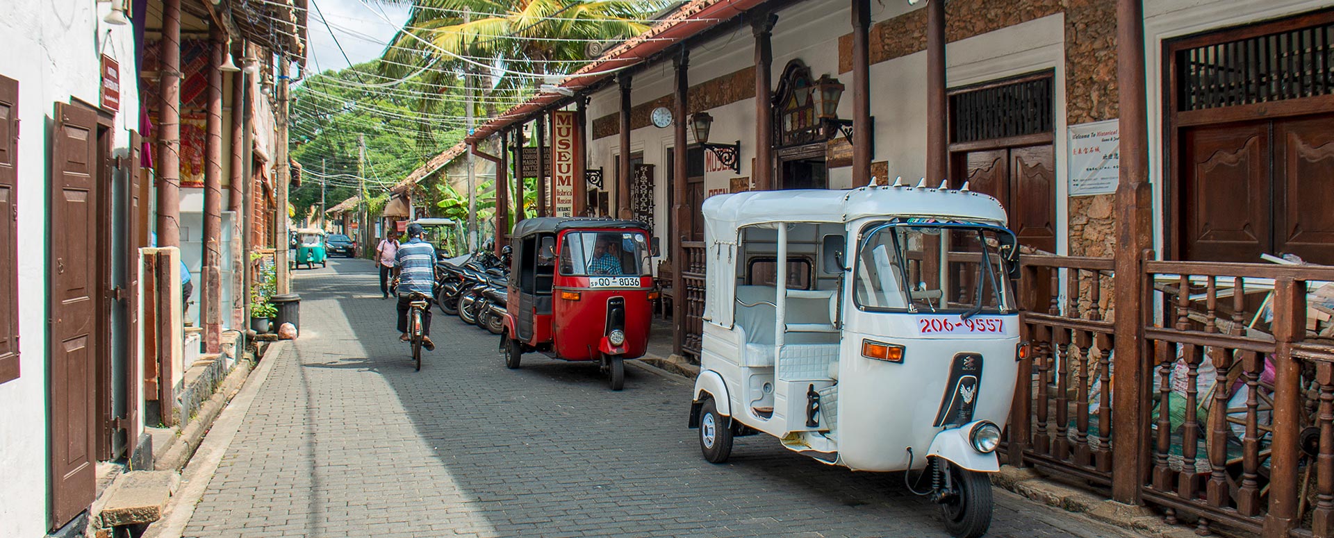 Colonial styled buildings on both sides of a cobblestone pathway at Galle fort