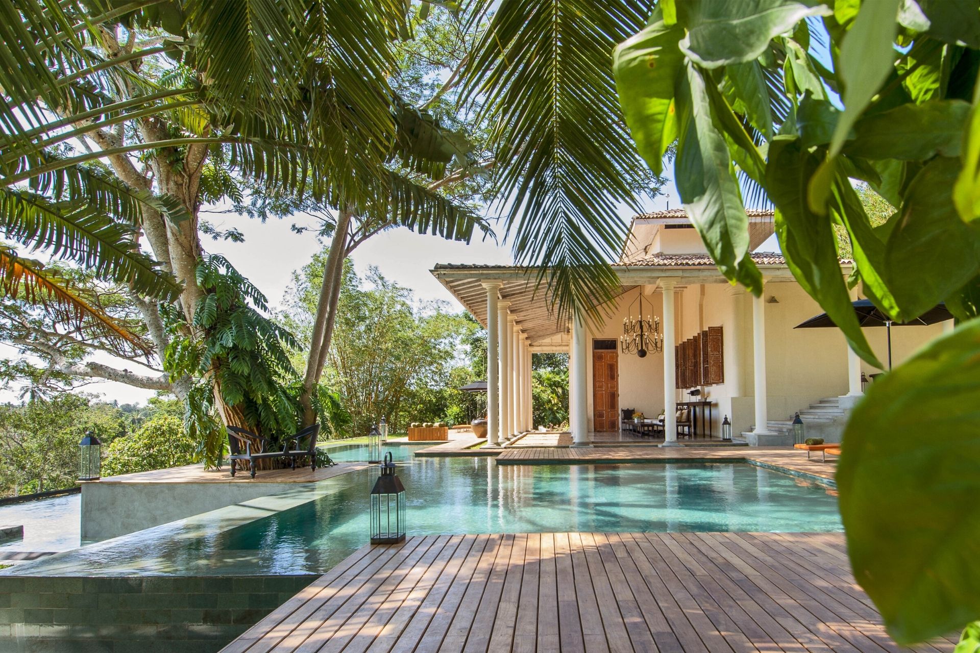 Outdoor lounge area of the colonial mansion overlooking the pool