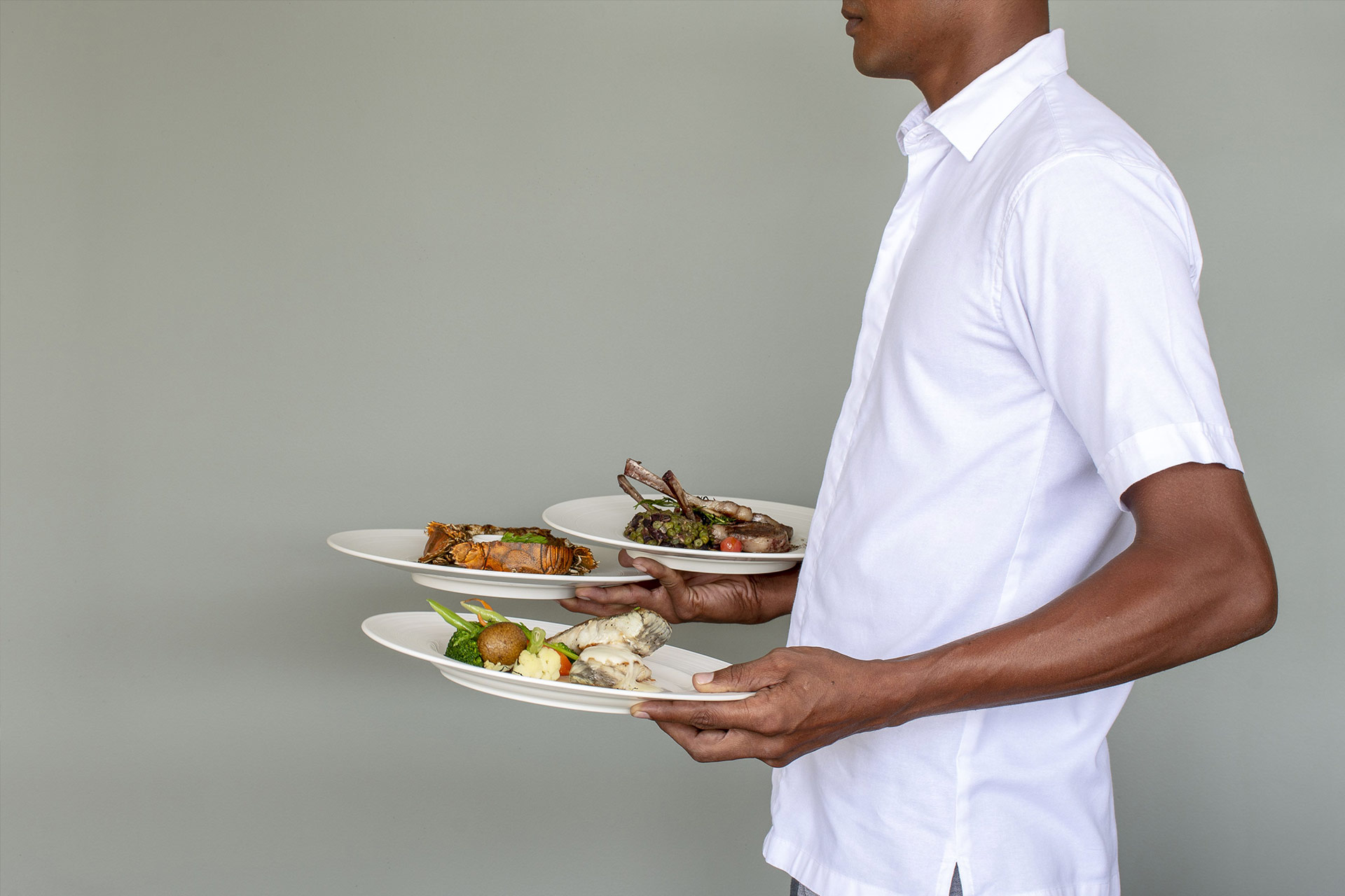 Villa master at Haritha Villas serving three dishes